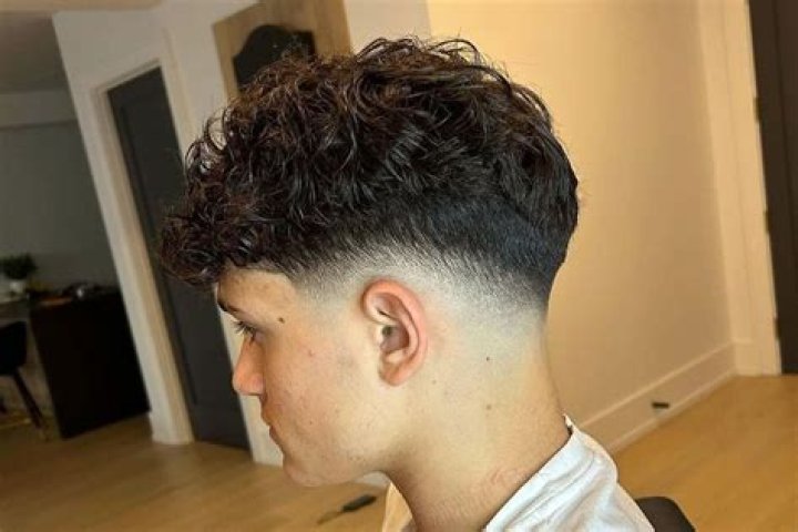 Why the Mid Fade Curly Hair Cut Is Dominating Barbershops Everywhere This Season